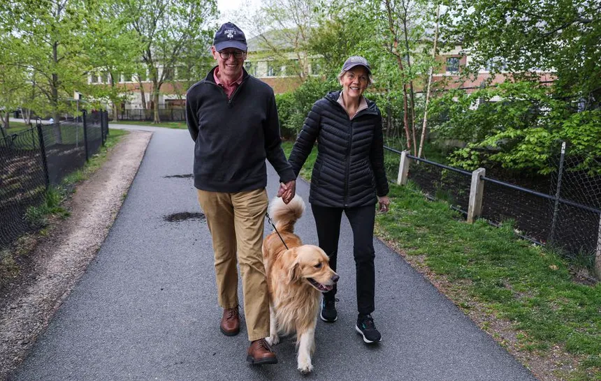 lizabeth Warren on a walk with her husband, Bruce Mann